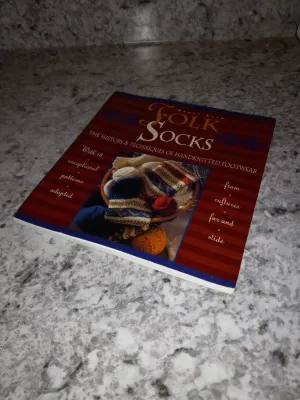 Folk Socks Paperback Book